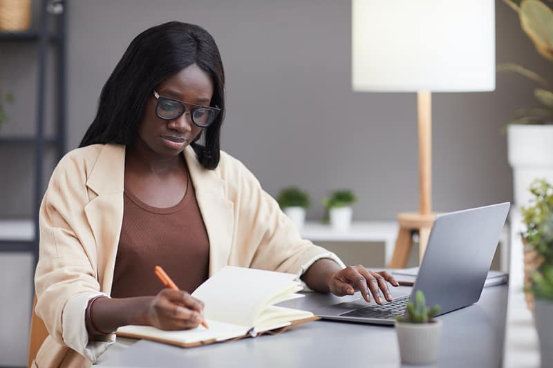 Successful African Businesswoman Planning Schedule